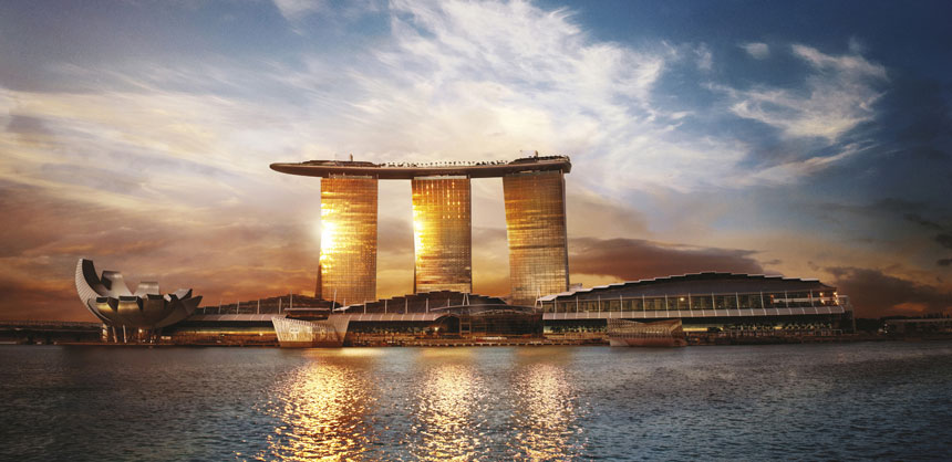 The distinctive, triple-towered Marina Bay Sands in Singapore features SkyPark, a rooftop venue the size of three football fields. Credit: Marina Bay Sands