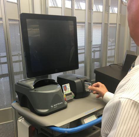 A driver’s license is inserted into a credential authentication technology (CAT) unit to determine if it is authentic. (TSA photo)