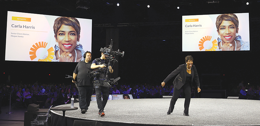 Bring in dynamic speakers to keep attendees engaged. Pictured: Carla Harris speaks at GBTA 2024 in Atlanta. Courtesy of GBTA